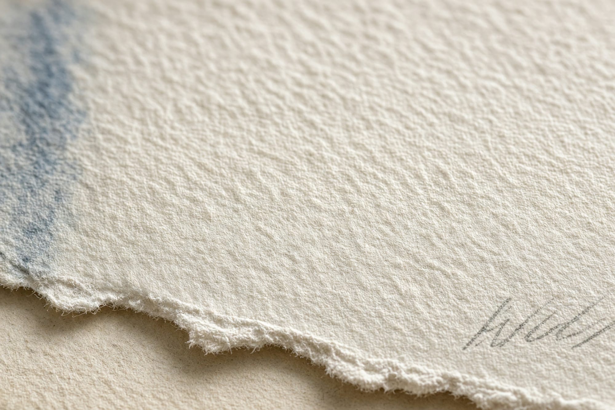 Macro of the sheet surface with a pencil signature in the margin